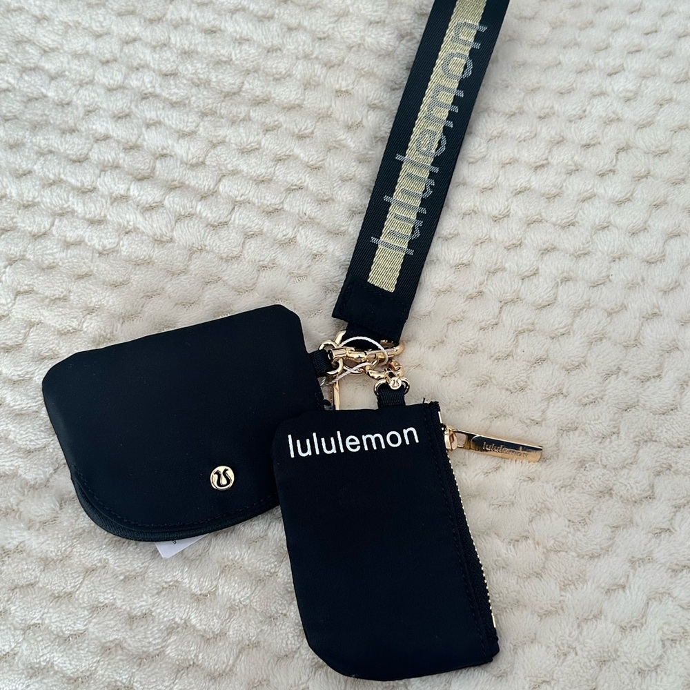 NWT Lululemon Black Dual Pouch Wristlet with Gold Details logo